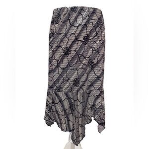 Cato Brand Ladies Asymmetrical Ruffle Skirt with Floral Pattern in Black & Tan